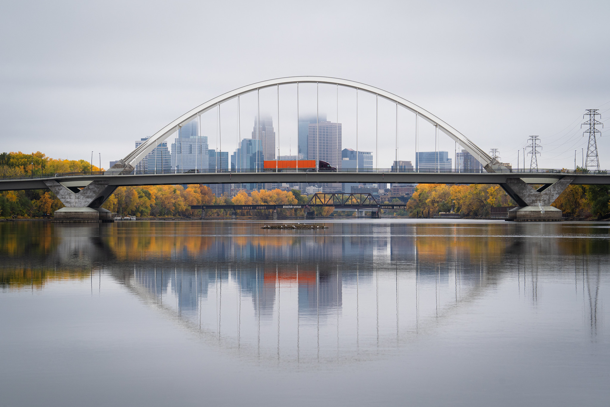 Fall colors surround the Lowry Avenue Bridge over the Mississippi River in Minneapolis.